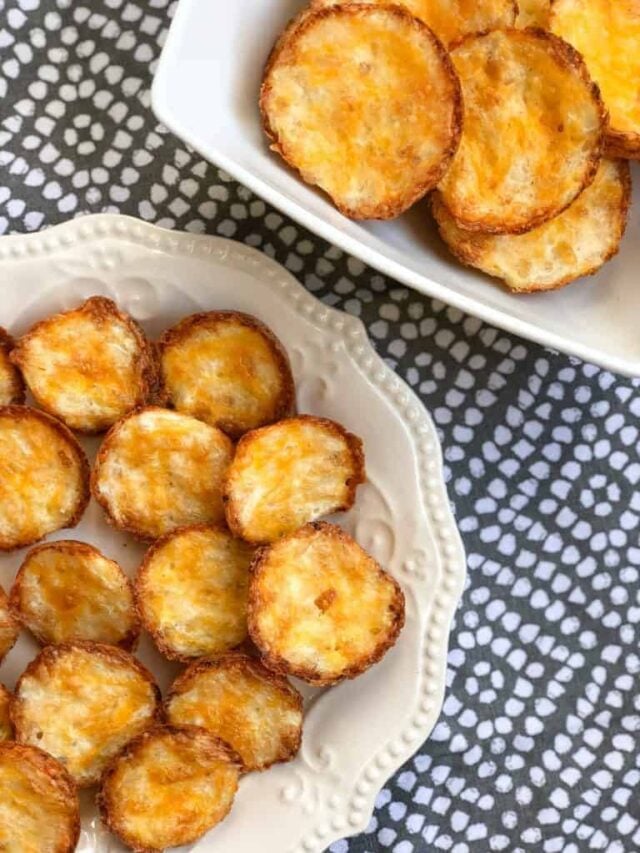 Cauliflower bites on a fancy white plate.