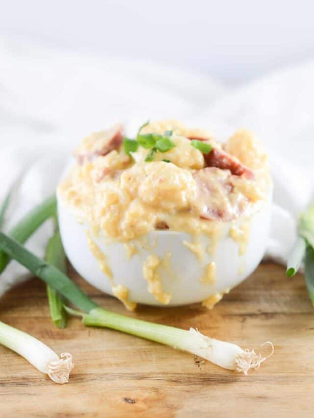 A plate of food with cheese and Cauliflower