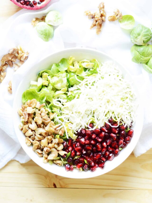 A bowl of food on a plate, with Salad