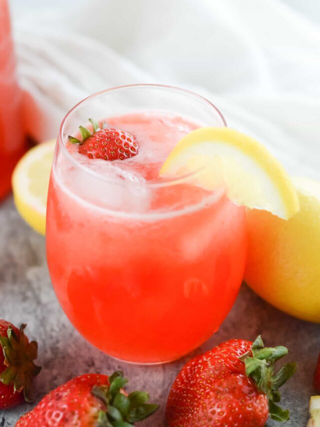 A bowl of fruit on a table, with Lemonade