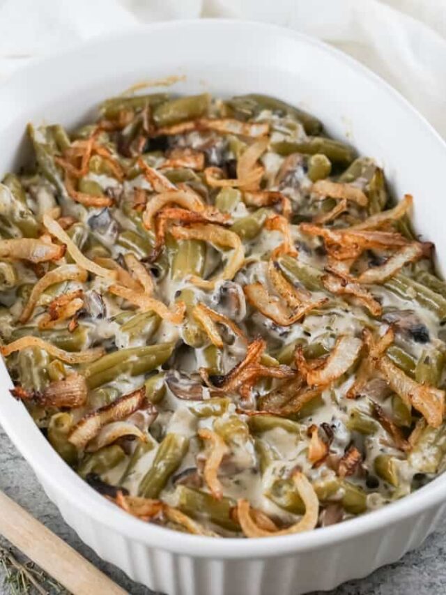 A keto-friendly casserole dish brimming with green bean goodness, topped with crispy fried onions.
